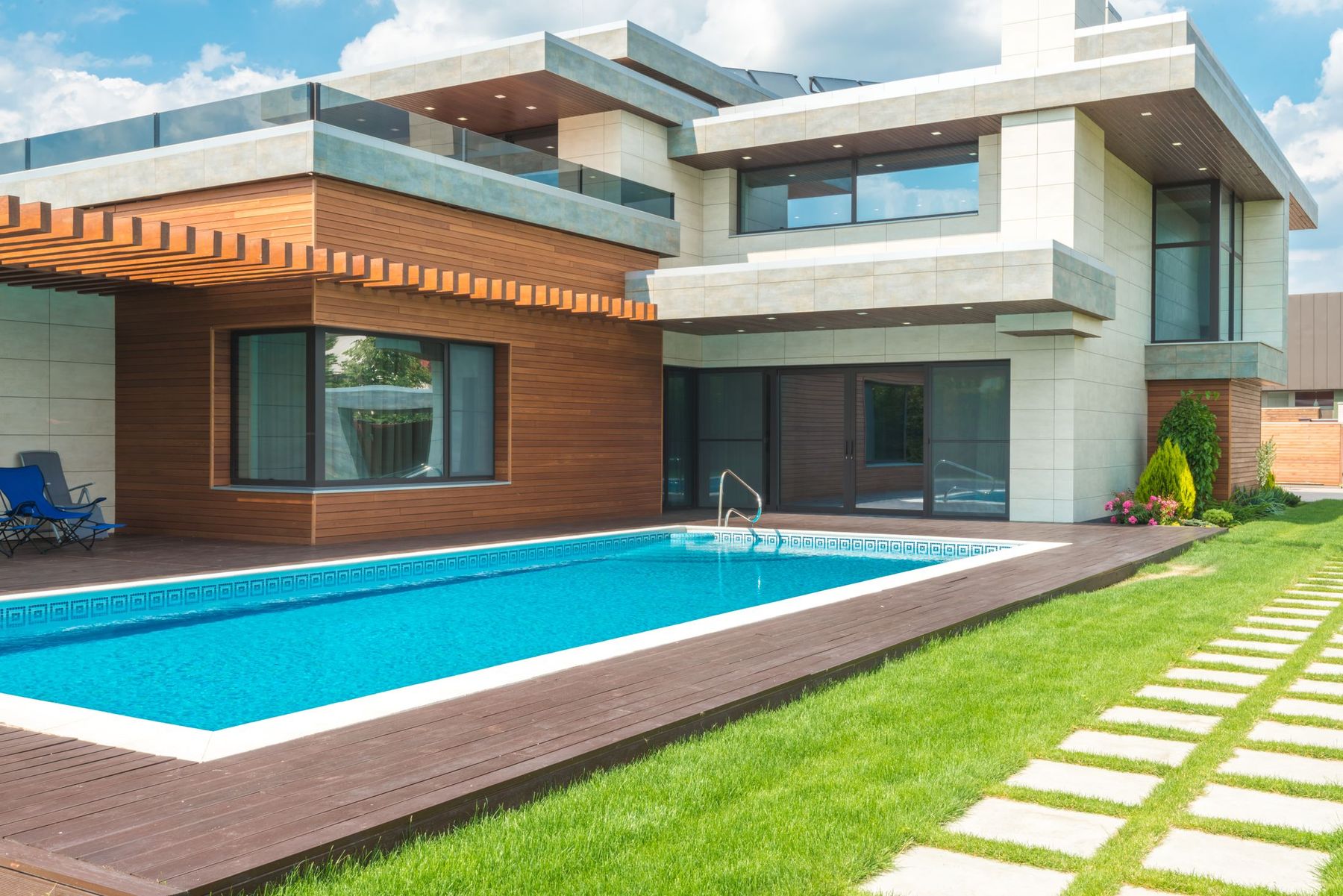 Custom home exterior with pool